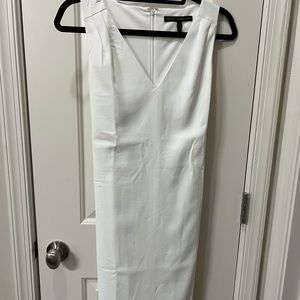 White v neck dress with zipper at back.